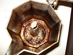 Image of a coffee carafe with oily residue